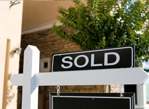 Sold sign in front of Elmhurst Providence RI home — sell your house fast for cash with We Pay More Properties