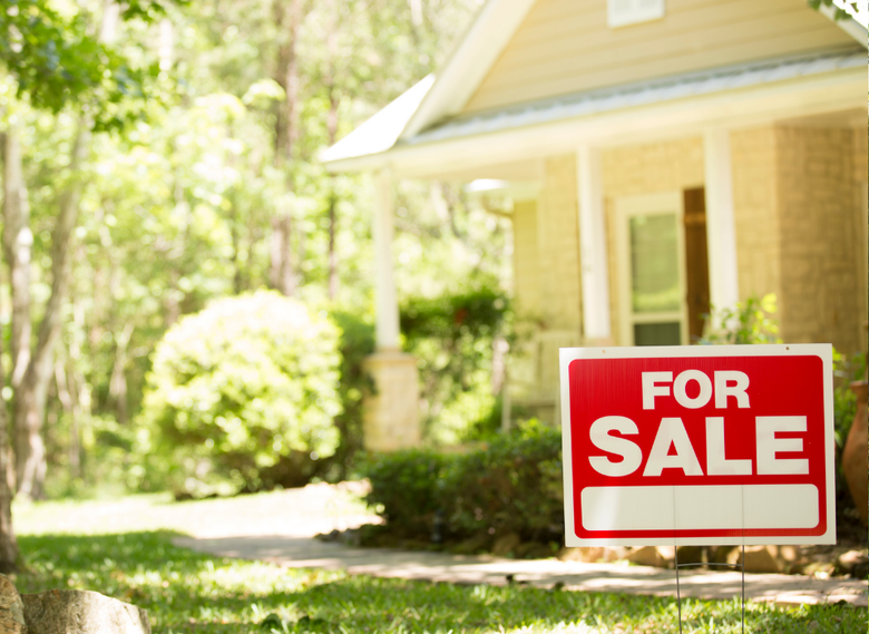 For Sale sign in front of tree-lined home on the East Side of Providence RI — sell your house fast for cash with We Pay More Properties